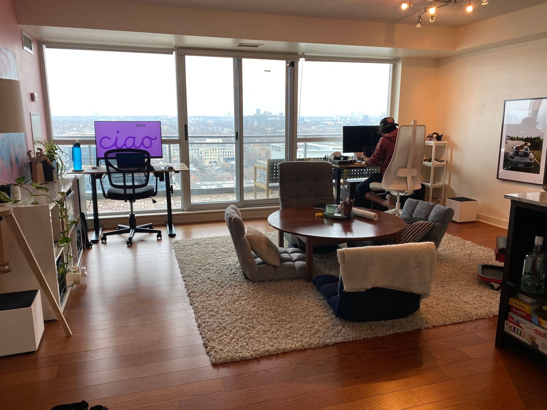 pic of the full condo with floor chairs and desks facing windows